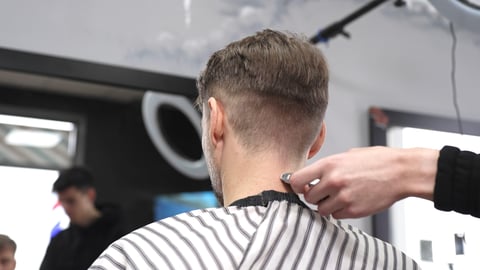 Barber shaving neck with straight razor
