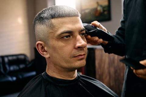 Professional barber giving a fresh haircut